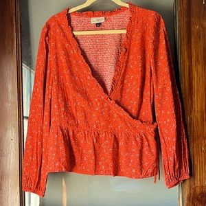 Beautiful orange and cream flower wrap top